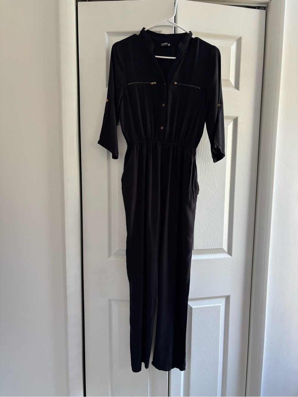 indulge Black Jumpsuit with Gold Zipper Accents